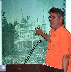 David Nellist, retired gardener for the VA, with slide of building torn down to make way for hospital.